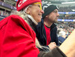 © tessy morelli/Stocksy - UGC family sport moment at the hockey game