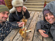 © tessy morelli/Stocksy - UGC POV winter selfie eating poutine