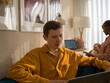© Milles Studio/Stocksy - Multiracial freelancers with baby at home