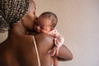 © Milles Studio/Stocksy - Mom showing love to newborn
