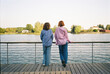© Viktor Solomin/Stocksy - Two friends enjoying a peaceful moment by the lake