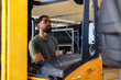 © Jovo Jovanovic/Stocksy - Serious male worker working on forklift in industry
