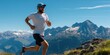 © trustmastertx - Man trail running in mountains, sunny day.