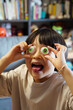 © ChaoShu Li/Stocksy - A little Chinese boy plays with an eyeball toy at home