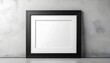 © Adeen - Black Frame with White Space for Text on Concrete Wall