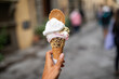 © Lupe Rodriguez/Stocksy - ugc of woman showing a large ice cream in a village in italy