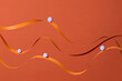© Marc Tran/Stocksy - Abstract Minimalist Art With Orange Ribbons and Blue Spheres