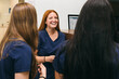 © VICTOR TORRES/Stocksy - Team discussion and laughter brighten the dental clinic