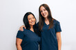 © VICTOR TORRES/Stocksy - Friendly dental clinic team in professional uniforms