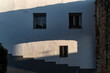 © Manu Prats/Stocksy - Shadow resembling human face on whitewashed wall