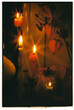© Natalia Mishina/Stocksy - Warm candlelight enhancing a cozy atmosphere in a serene setting