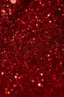 © Jelena Sijak/Stocksy - Sparkling red glitter background with bright highlights