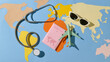 © Marc Tran/Stocksy - international medical travel insurance concept on world map