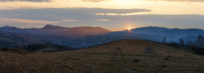 Wall Mural - picturesque sunset panorama above late autumn mountain countryside. ukraine, carpathian mountains.