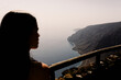 © Adrian Rodd/Stocksy - Female silhouette backlit by sunlight at top of La Peña viewpoint