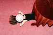 © Ulas&Merve/Stocksy - Surreal Woman with Balloon Head on Pink Carpet