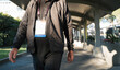 © Amy Covington/Stocksy - Man Walking to a Convention