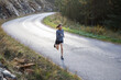 © Jovo Jovanovic/Stocksy - Determined woman in sportswear jogging on road