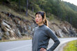 © Jovo Jovanovic/Stocksy - Exhausted fit woman taking break at roadside