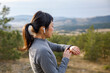 © Jovo Jovanovic/Stocksy - Active woman checking stopwatch while exercising