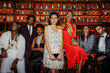© BONNINSTUDIO/Stocksy - Elegant friends celebrating new year's in a luxurious vintage bar ugc