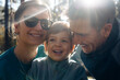 © Santi Nuñez/Stocksy - Smiling family portrait under warm sunlight