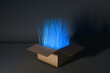 © Marcos Osorio/Stocksy - Surprising cardboard box revealing blue light beams and new technology