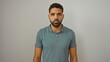 © Krakenimages.com - Young hispanic man posing against isolated white background showcasing attractive adult male with neat beard wearing casual green shirt