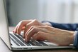 © New Africa - Businessman using laptop indoors, closeup. Modern technology