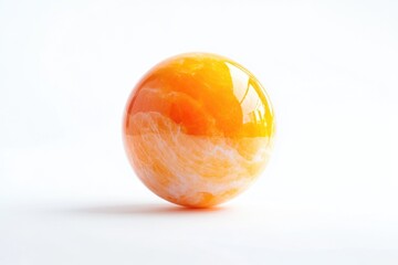 A close-up shot of an orange sitting on a white surface