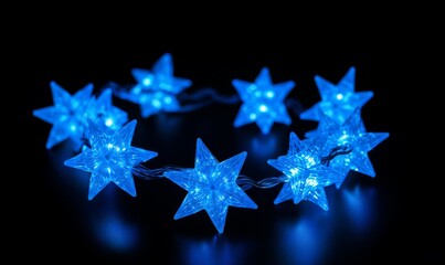 Wall Mural - a string of star-shaped blue lights for decorative illumination in indoor or outdoor settings, suita