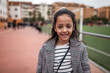 © Lupe Rodriguez/Stocksy - girl on a soccer field watching the game