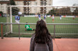 © Lupe Rodriguez/Stocksy - girl on a soccer field watching the game