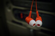 © Anze - A pair of earbuds with red base and white part that goes into the ear. Airline specific ear plugs
