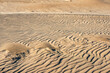 © Manu Prats/Stocksy - Abstract sand ripples with soft shadow patterns