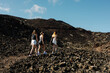 © Adrian Rodd/Stocksy - Sporty friends taking recreational hike in the Canary Islands' scenery