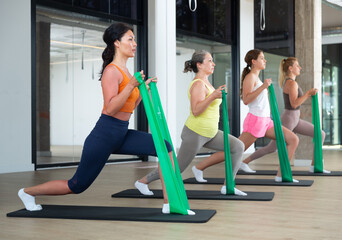 Wall Mural - Group of people with working out with rubber bands