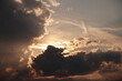 © rolfo/Stocksy - The sky is cloudy and the sun is setting