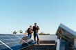 © Lucas Ottone/Stocksy - Homeowners inspecting their solar panels