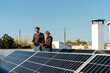© Lucas Ottone/Stocksy - Homeowners inspecting their solar panels