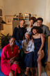 © BONNINSTUDIO/Stocksy - Happy family celebrating christmas together at home