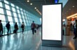 © Pete - Blank billboard mockup in airport terminal. People walk around. Modern design, empty advert space. Urban hall in big city station. Interior view of building. Travel, business concept. Empty poster in