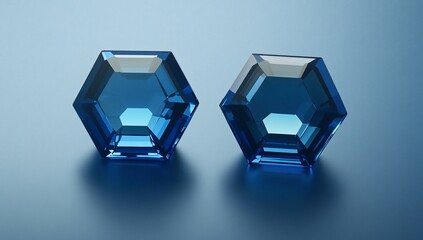 Aufkleber - Two vibrant blue hexagonal gemstones displayed against a subtle blue backdrop, showcasing their brilliance and facets.