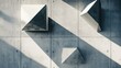 © Natchooda - Geometric shapes placed on a concrete background, casting shadows in a minimalist arrangement that highlights modern design and artistic simplicity
