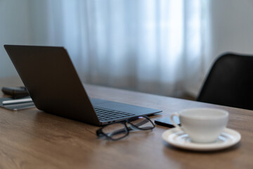 Wall Mural - close up view of computer a cup of coffee on a table working lifestyle