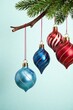 © Withun - Blue and red striped patterned ornaments hanging from a wooden branch, baubles, ornaments, decorated trees