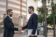 © be free - Business partnership. Business deal. Businessmen handshaking after contract deal. Successful agreement in business deal. Businessmen dealing outdoor. Partnership concept. Handshaking. advertisement