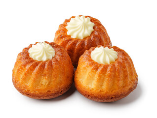 Wall Mural - Mini bundt cakes topped with cream frosting on a white background ready for dessert lovers