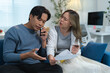 © crizzystudio - Young asian couple arguing about credit card bills and expenses, having financial problems and discussing with bank customer service via smartphone