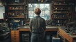 © artemstepanov - A craftsman standing in a workshop surrounded by tools, focusing on repair, maintenance